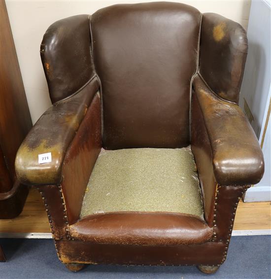 A 1940s French tan leather armchair
